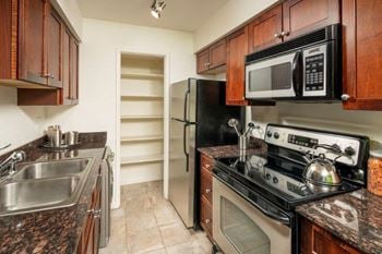 Gorgeous kitchens with backsplash, stainless steel appliances and large pantries