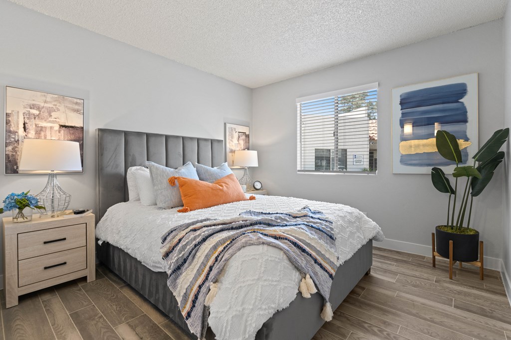 a bedroom with a bed and a nightstand