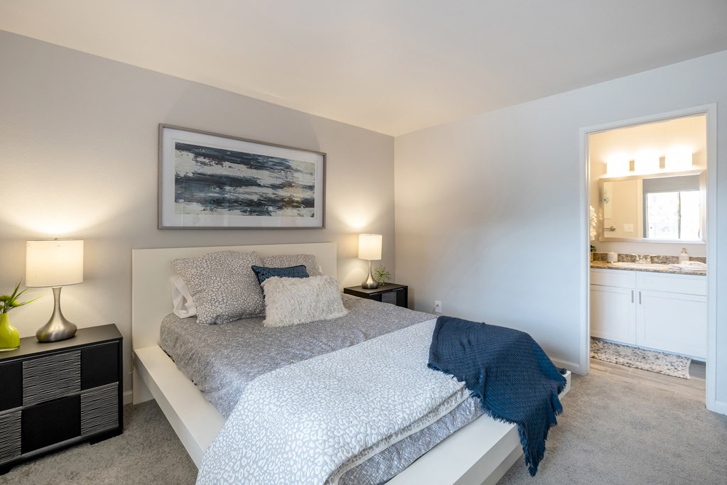 Newly renovated carpeted master bedroom with attached personal bathroom at apartment for rent near Phoenix, AZ