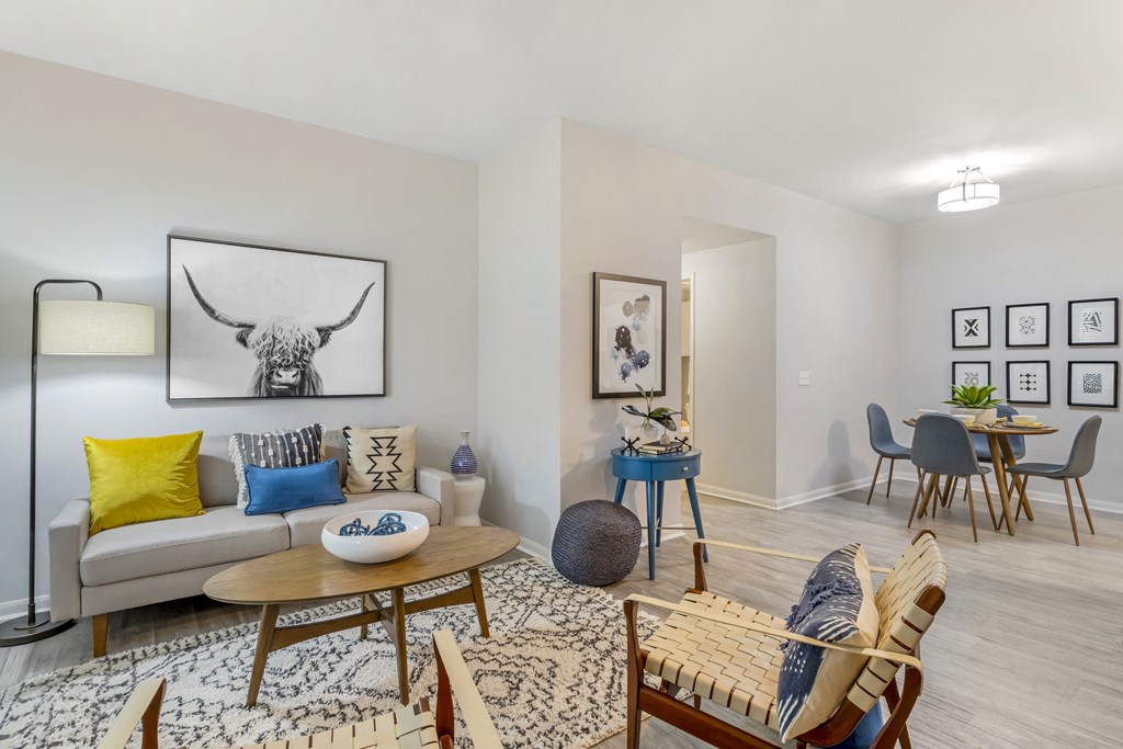 a living room with a couch and a dining room table