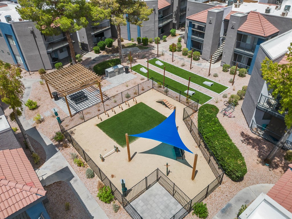 an aerial view of the community with a large blue tent in the middle of the yard