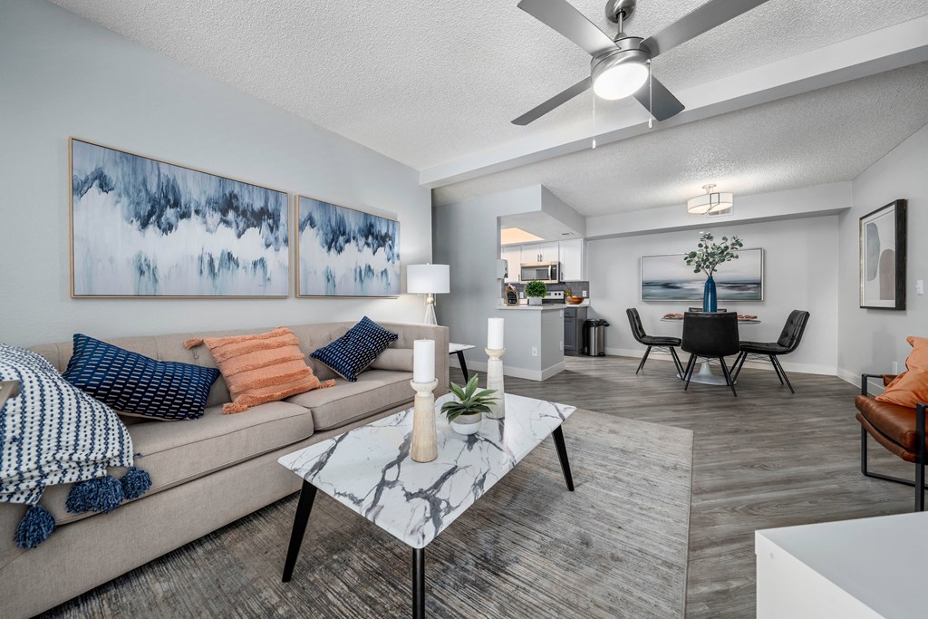 our apartments offer a living room with a couch a coffee table and a dining table
