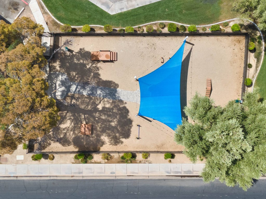 an aerial view of a volleyball court with a blue tarp