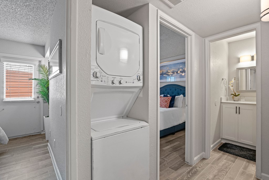 a bathroom with a washer and dryer