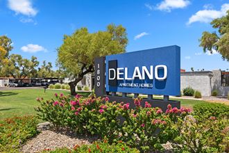 a sign that says delano apartments