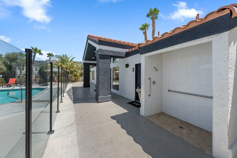 a white house with a pool in the background