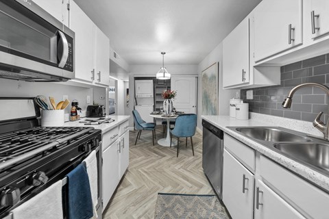 a kitchen and dining area in a 555 waverly unit