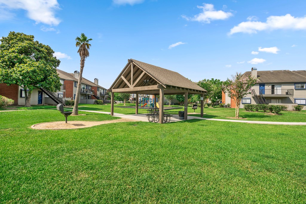 a park with a gazebo on the grass