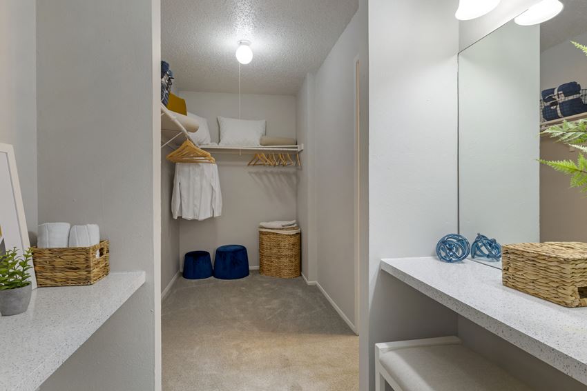 our closets in our apartments have a large mirror and plenty of closet space