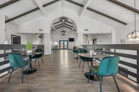 a dining area with tables and chairs