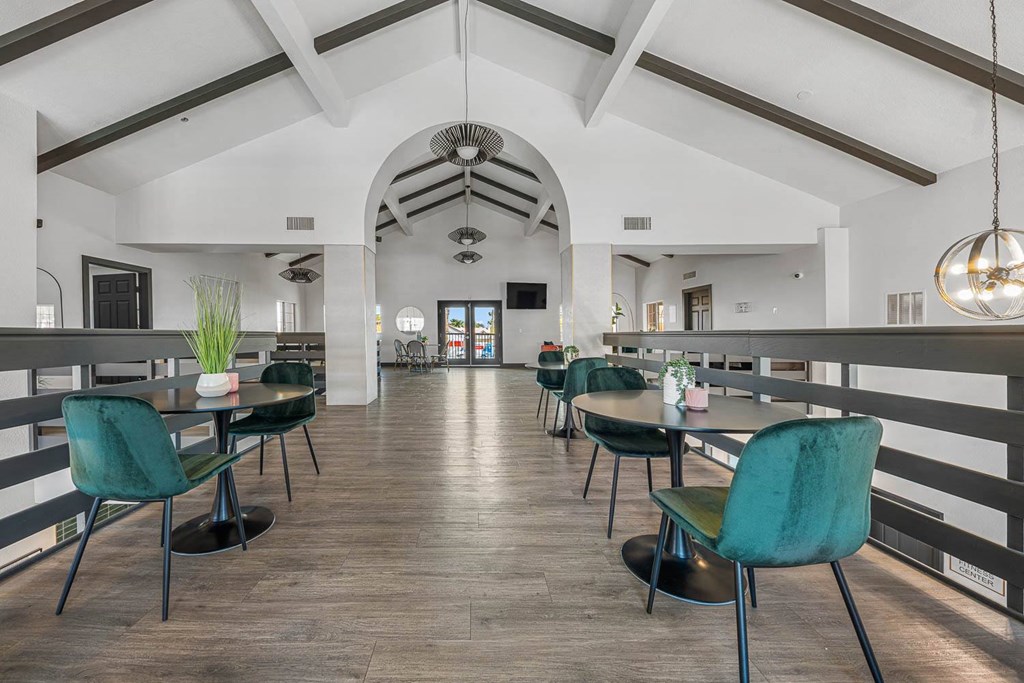 a dining area with tables and chairs