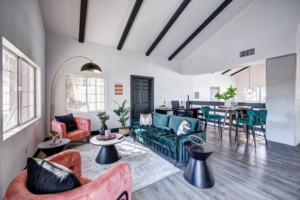 a living room with couches and chairs and a dining room table