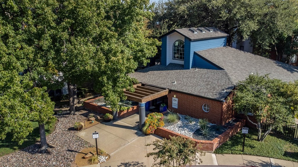 a birds eye view of a house with a roof and a deck