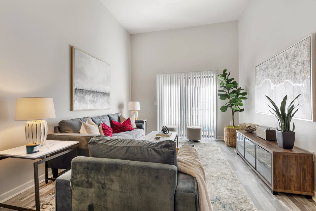 a living room with a couch and a chair and a table