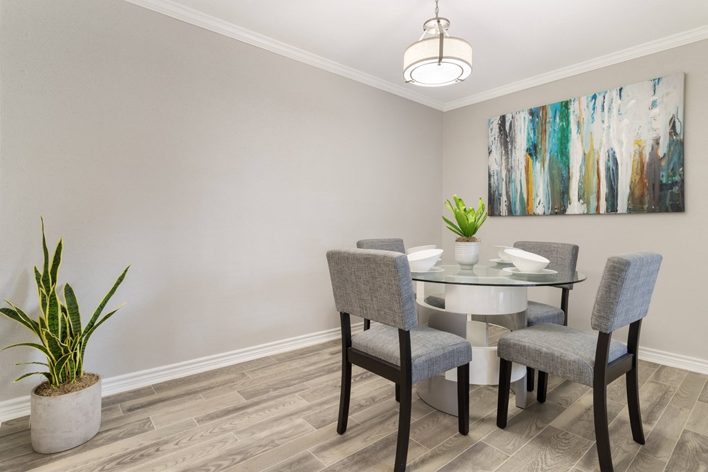 an image of a dining room with a table and chairs