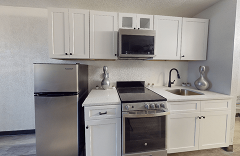 My Home at Macon | Renovated Kitchens w/ White Cabinets Stainless Steel Appliances