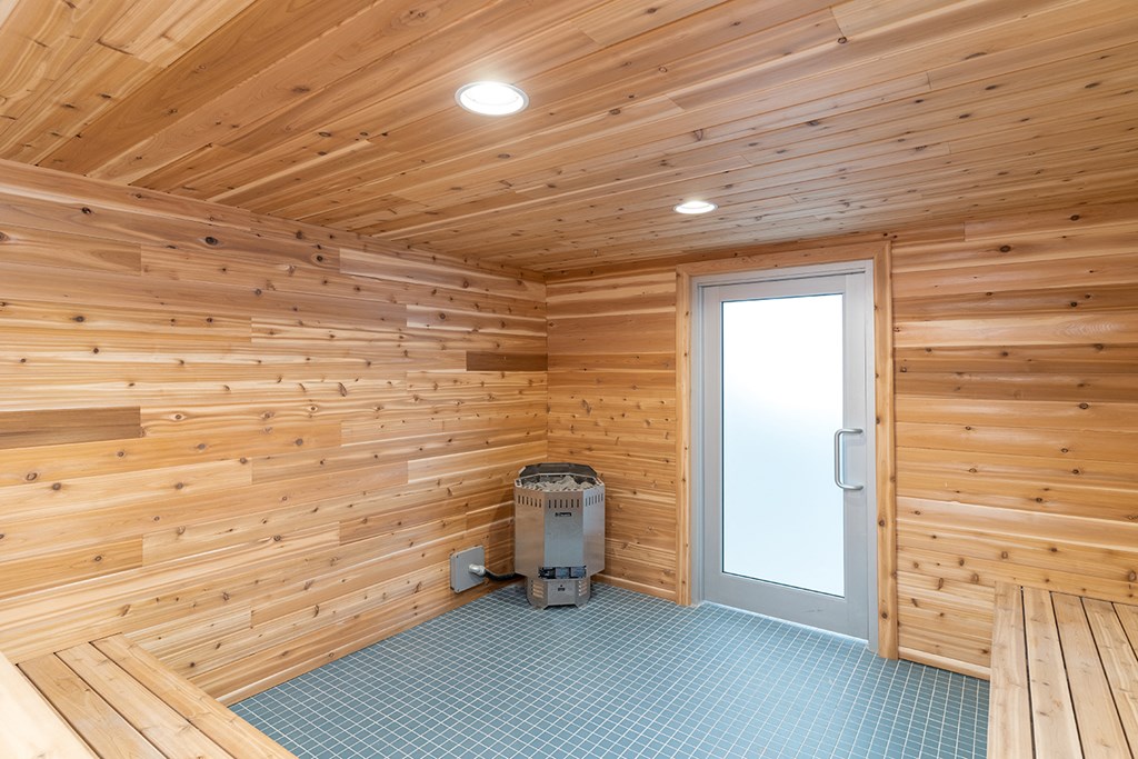 the interior of a wooden cabin with a door