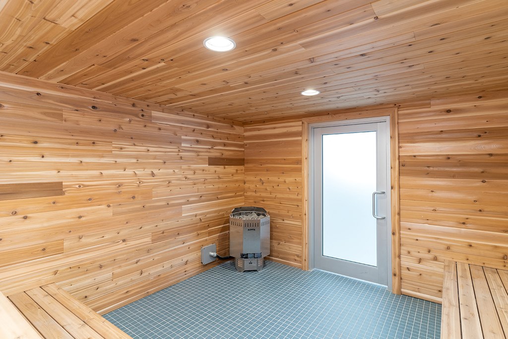 the interior of a wooden cabin with a door