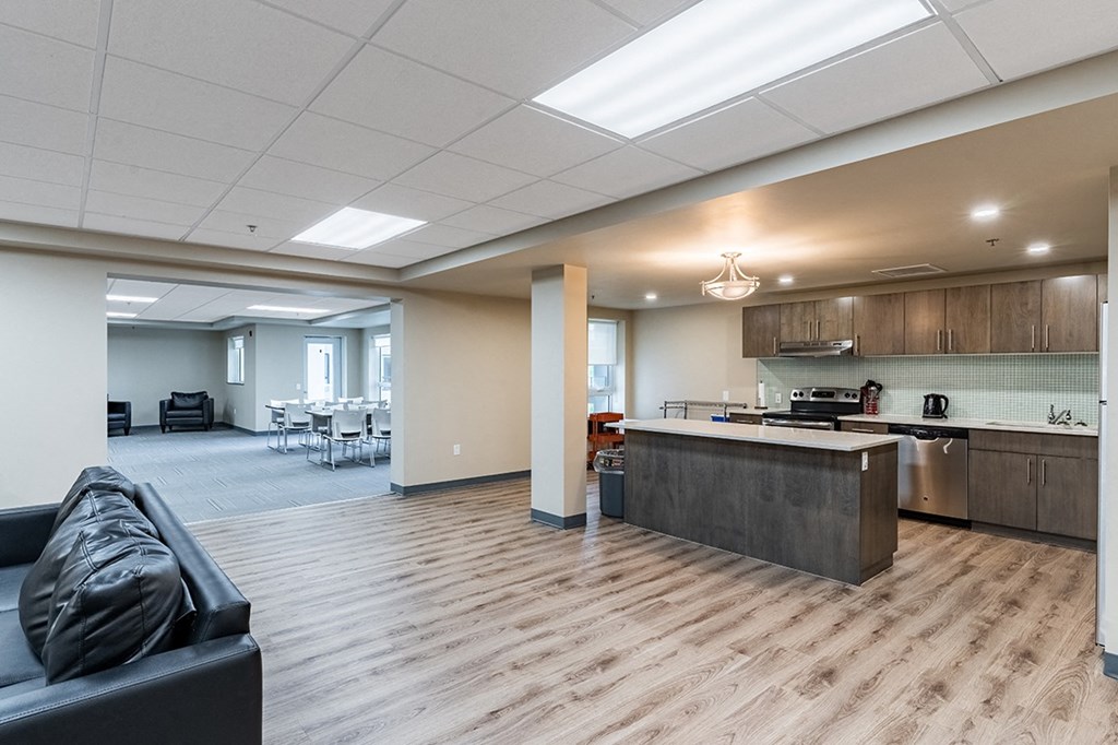 an open floor plan with a kitchen and living room