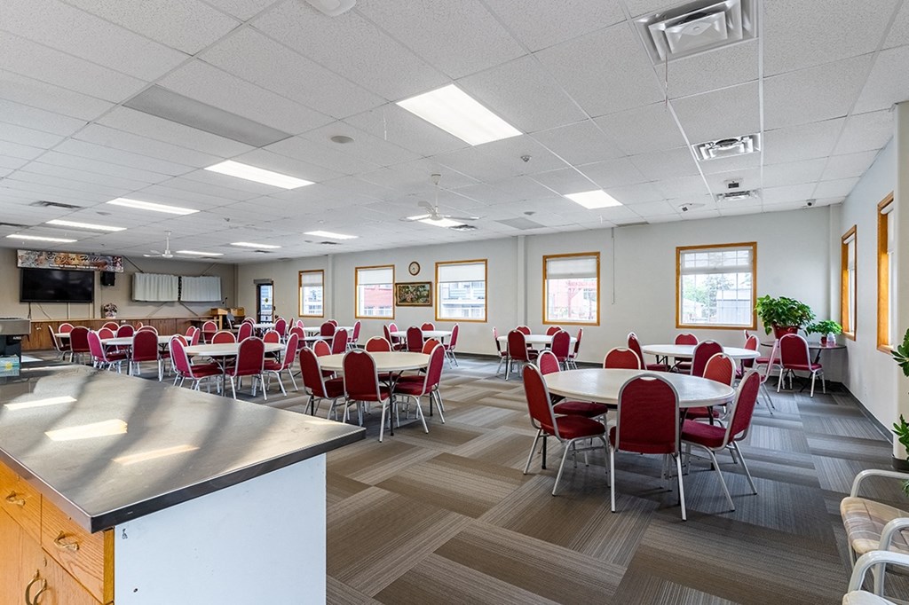 a large room with tables and chairs