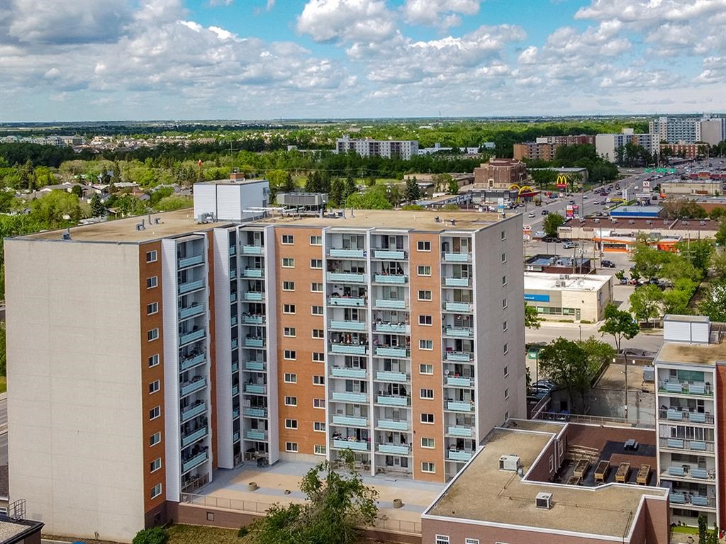 an aerial view of an apartment building in a city