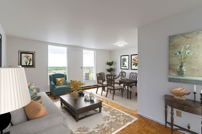 a living room with a couch a table and a chair - Photo Gallery