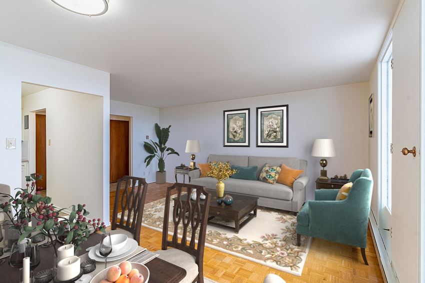 a living room and dining room with a table and chairs and a couch - Photo Gallery