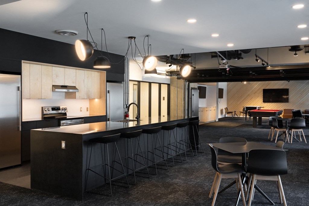 a kitchen and dining room in a modern office space