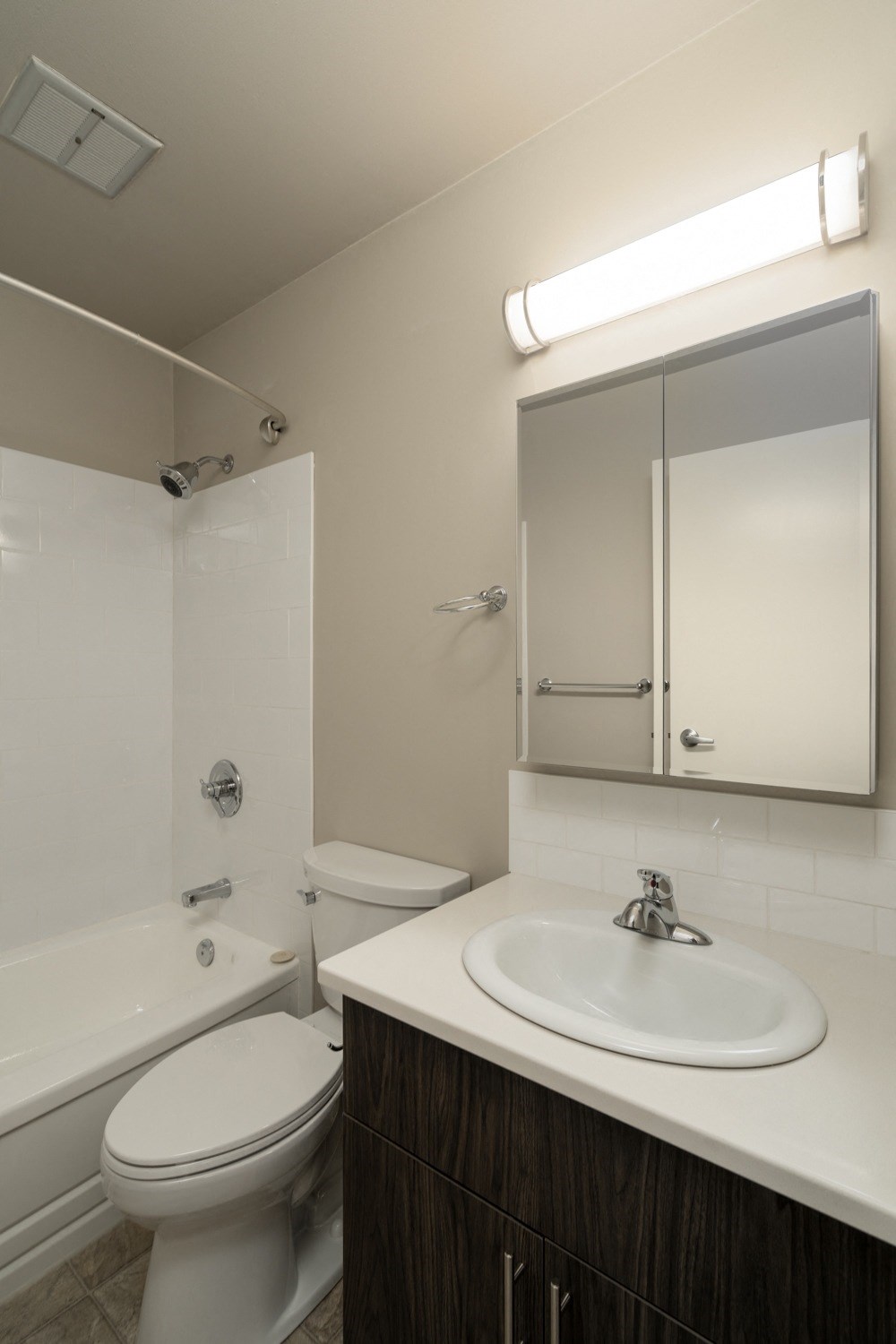 a bathroom with a sink toilet and bathtub