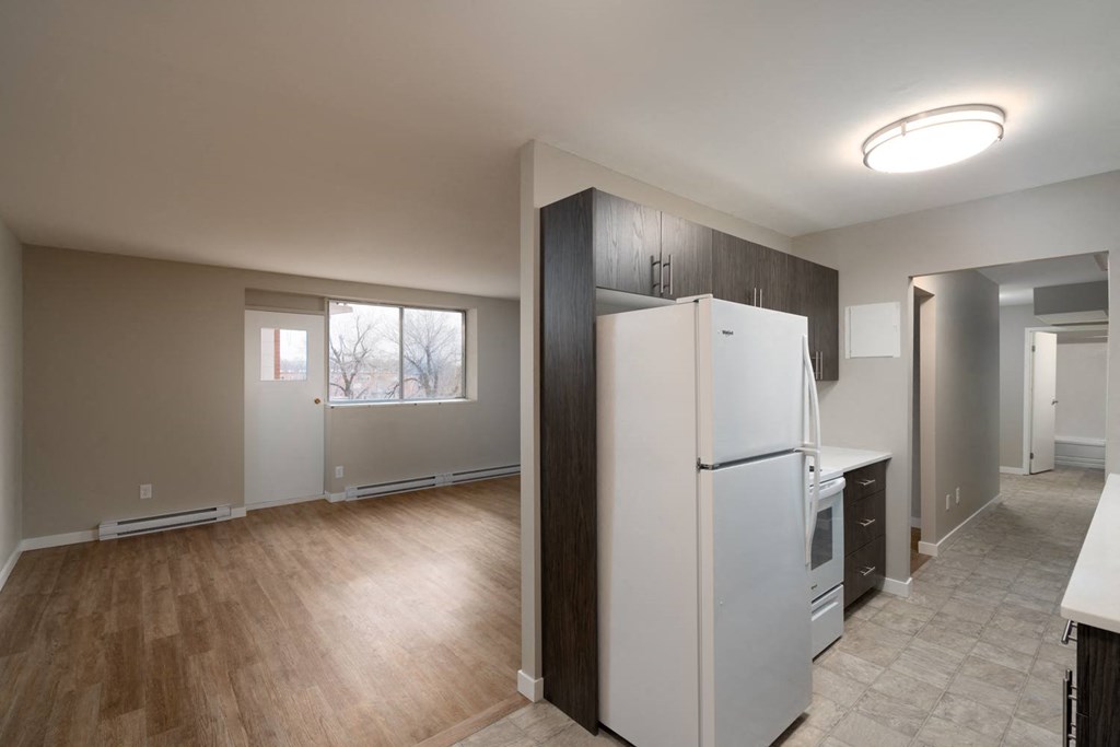 a kitchen and living room in a 555 waverly unit