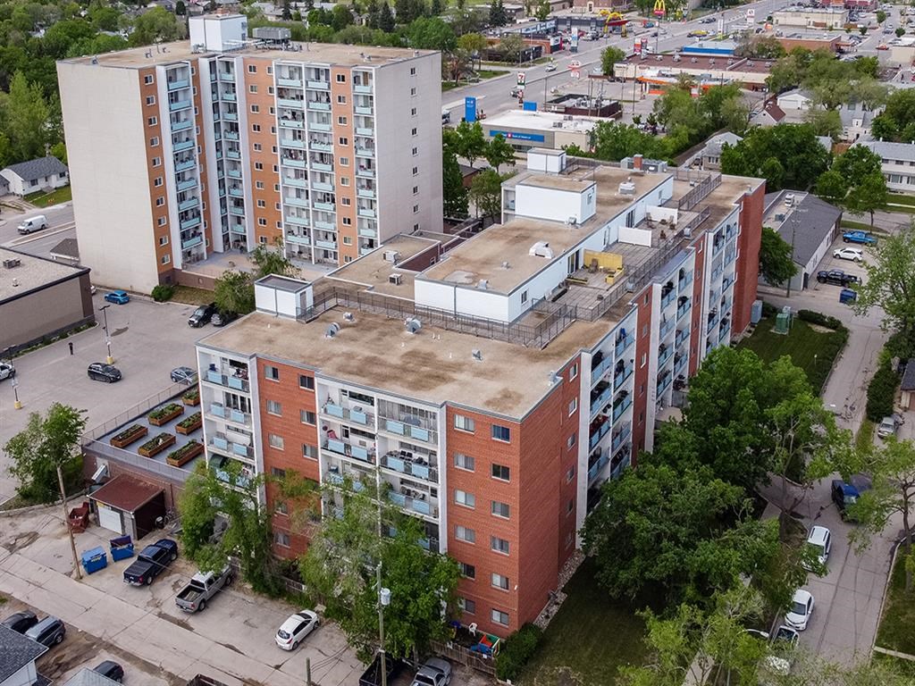an aerial view of an apartment building in a city