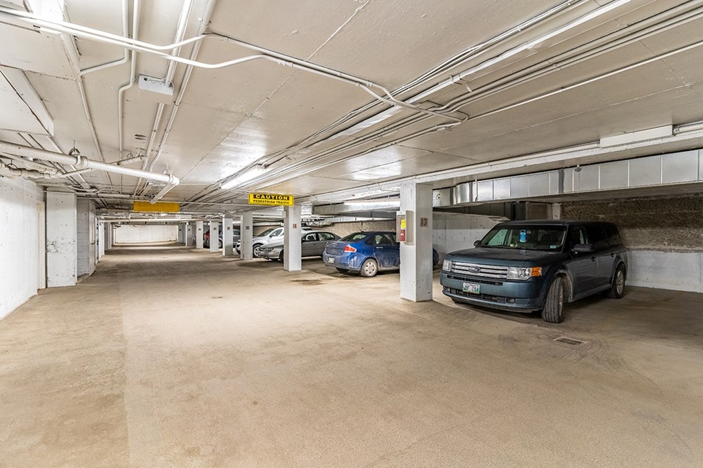 a parking garage with cars in it
