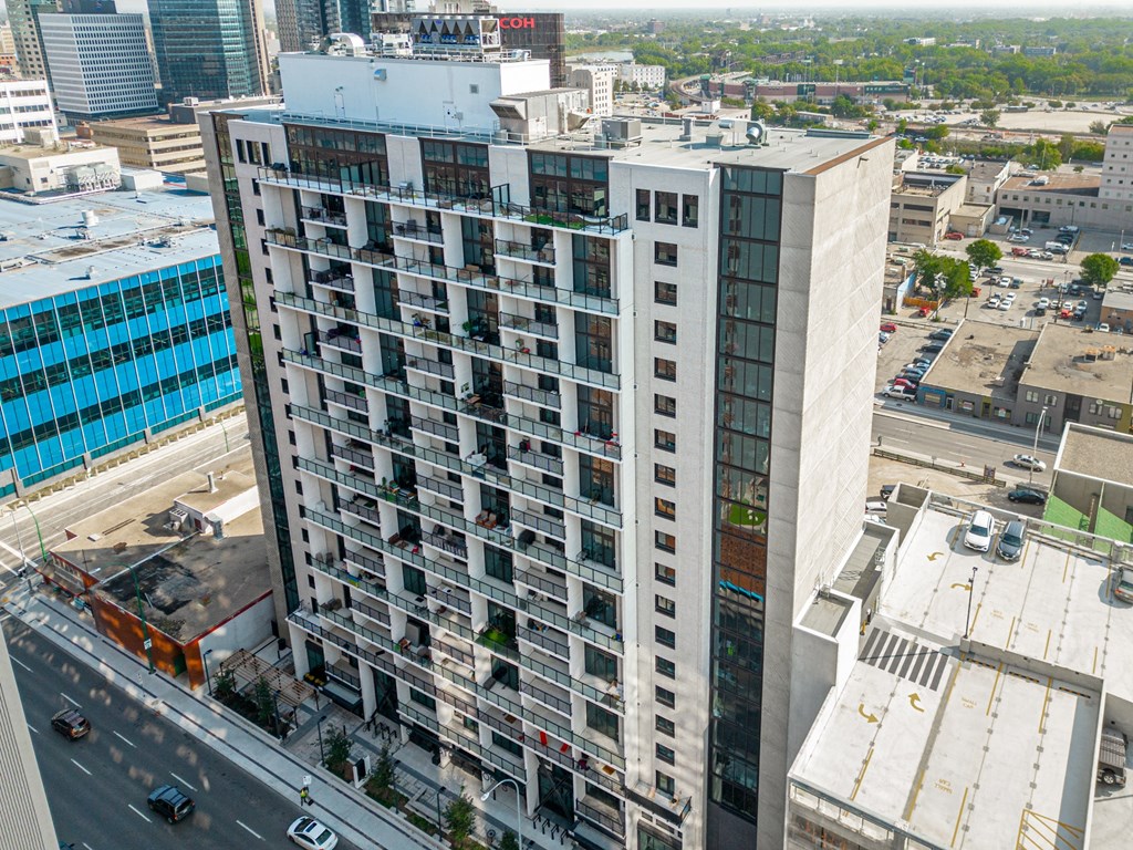 an aerial view of a tall building in a city