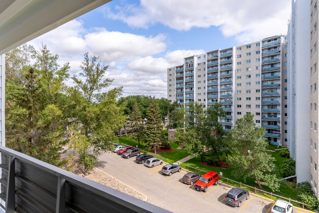 a view of the parking lot from the balcony