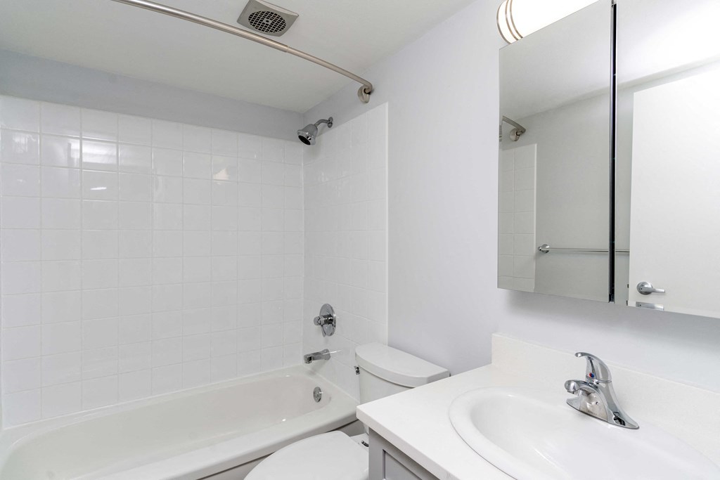 a bathroom with a sink toilet and bathtub