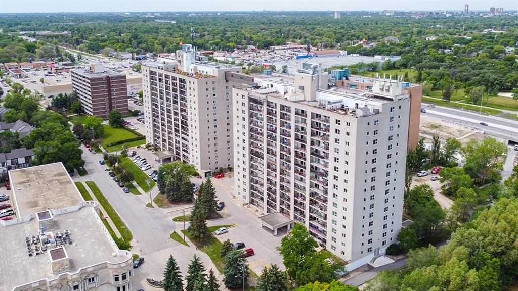 an aerial view of a city with tall buildings