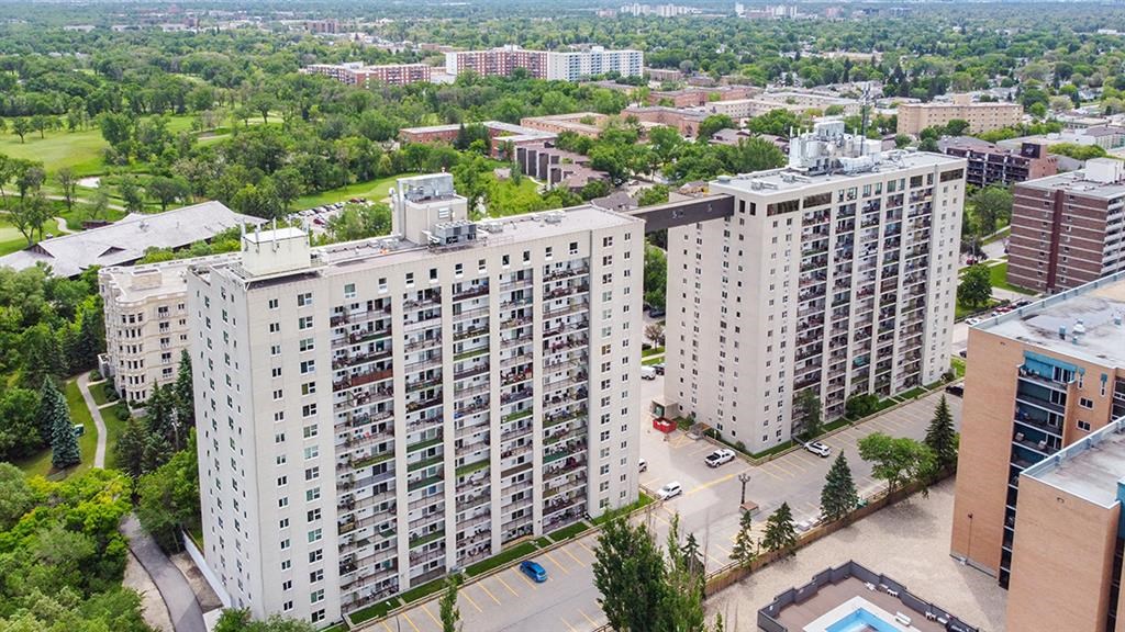 an aerial view of a city with tall buildings