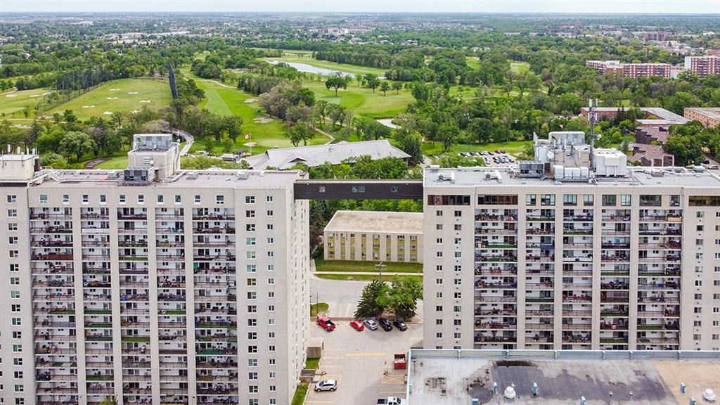 an aerial view of a city with tall buildings