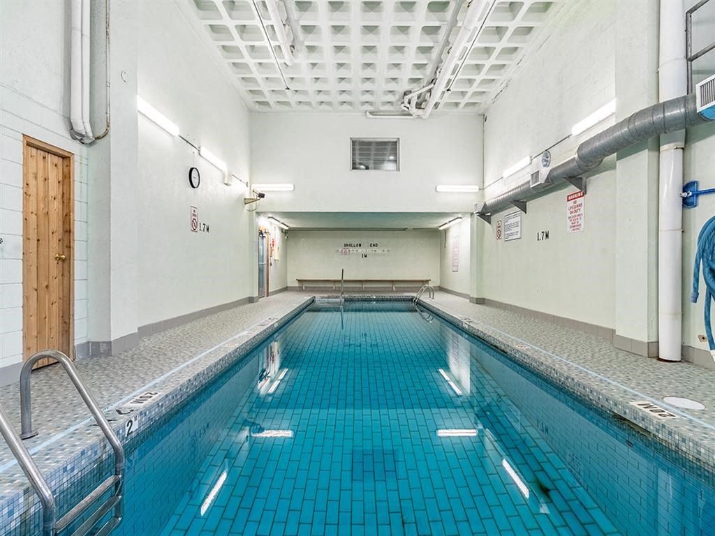 a swimming pool in a room with a door