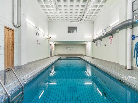 a swimming pool in a room with a door