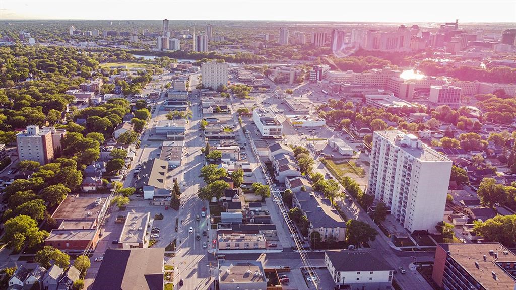 an aerial view of a city with buildings and trees