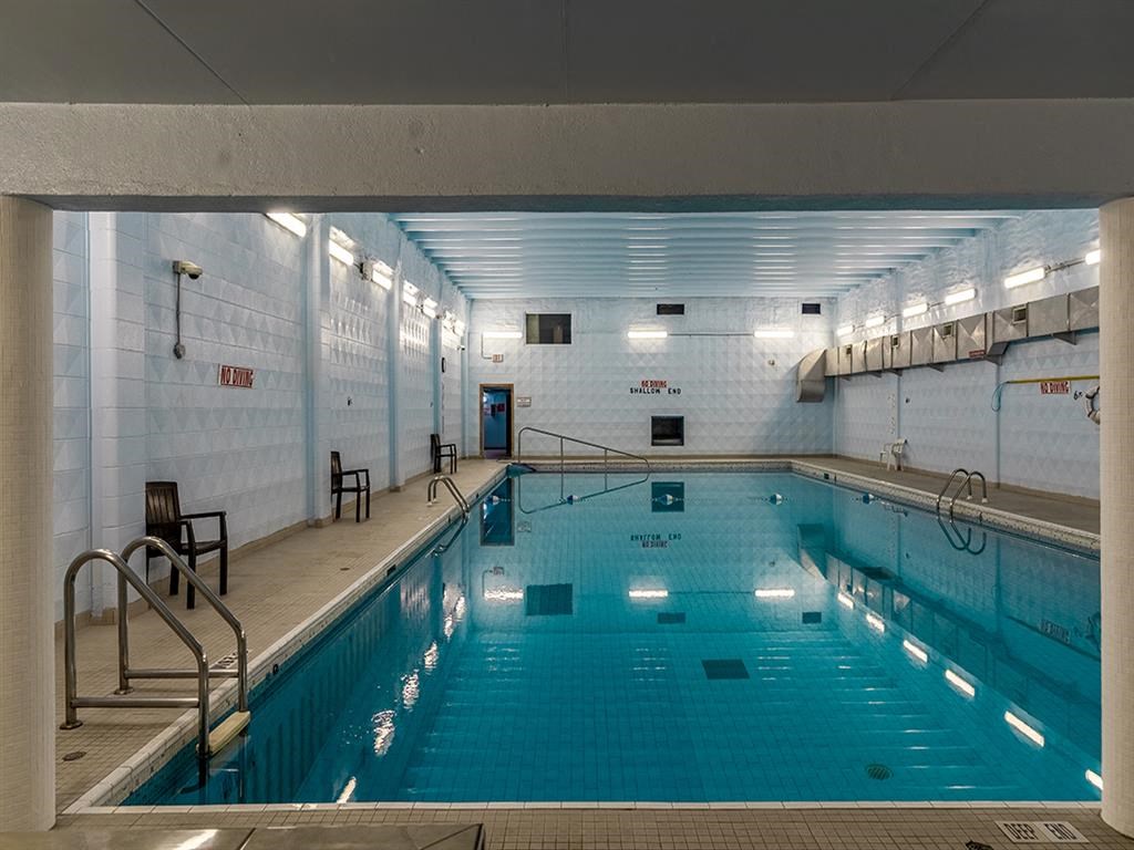 a large indoor swimming pool in a building with