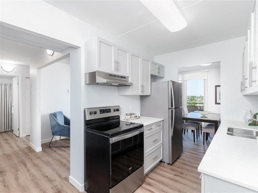 a kitchen with a stove and a refrigerator