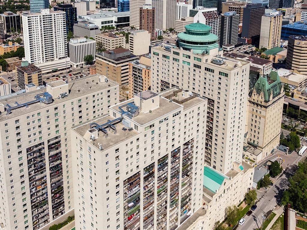 an aerial view of a city with tall buildings