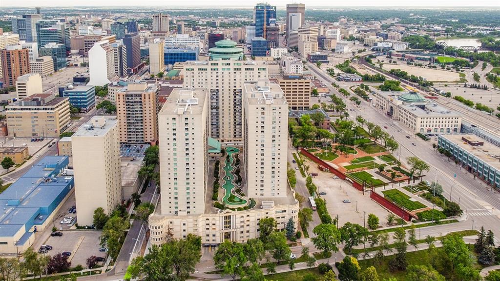 an aerial view of a city with tall buildings