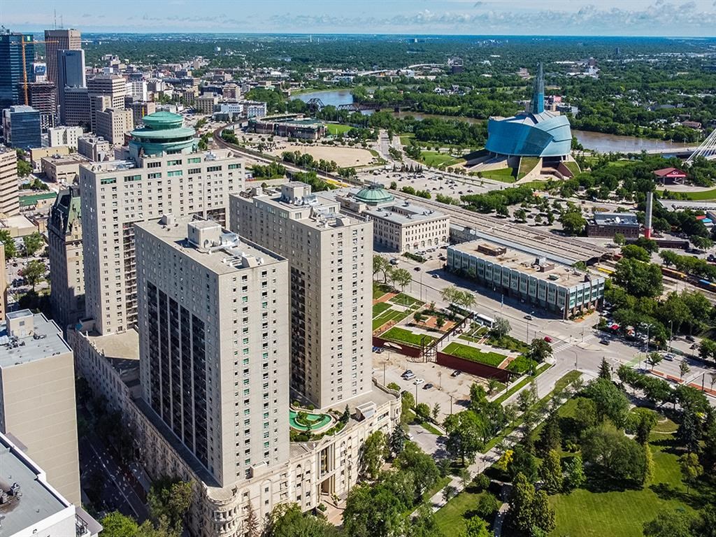 an aerial view of a city with tall buildings and a convention center