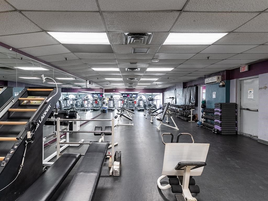a gym with weights and other equipment in it