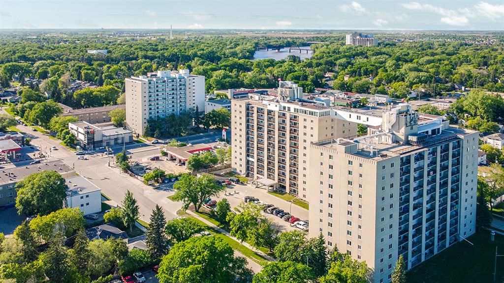 an aerial view of a city with tall buildings