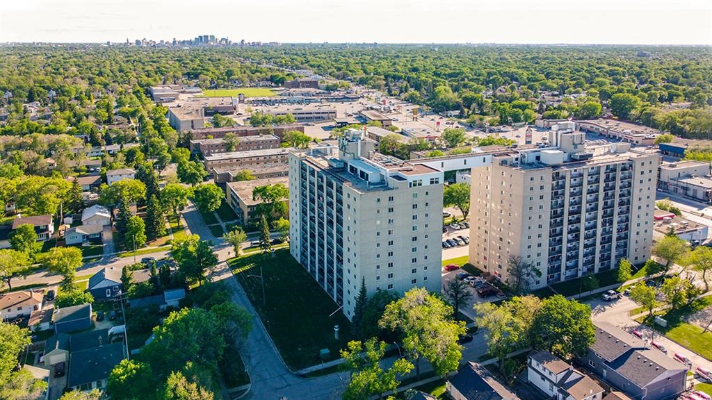 an aerial view of a city with tall buildings