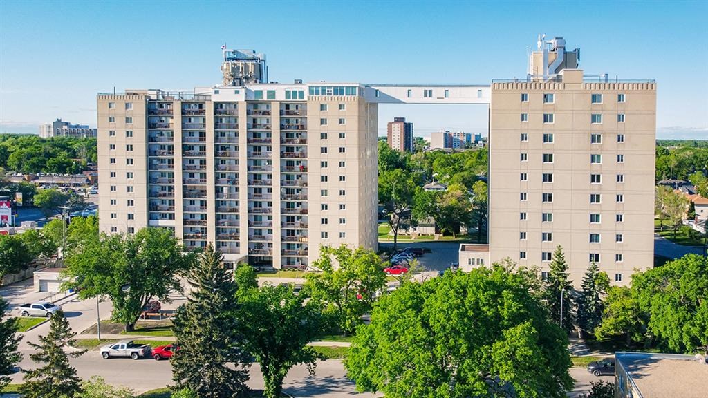 an aerial view of a city with tall buildings and trees